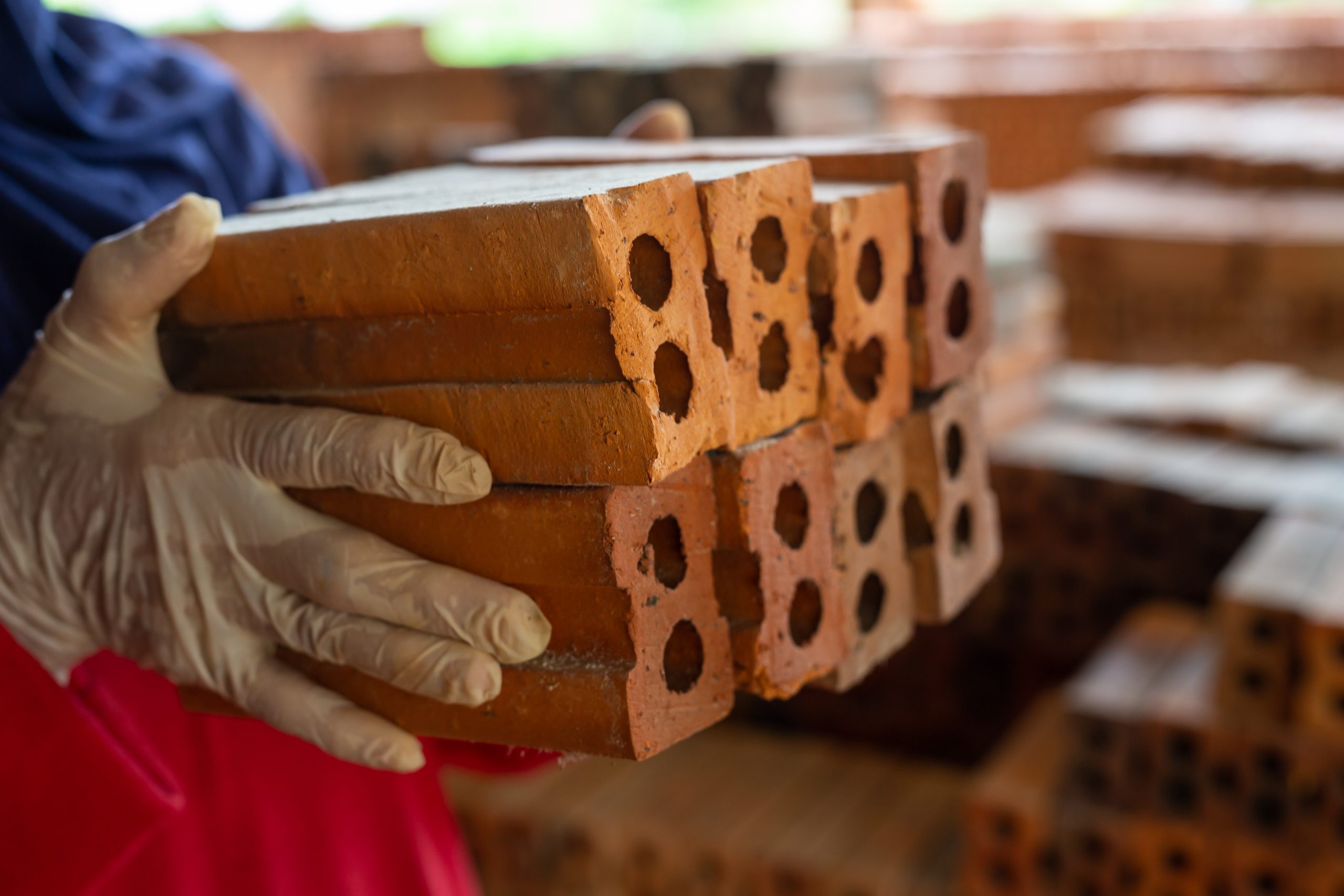 Servicios brick piles placed on the factory floor.