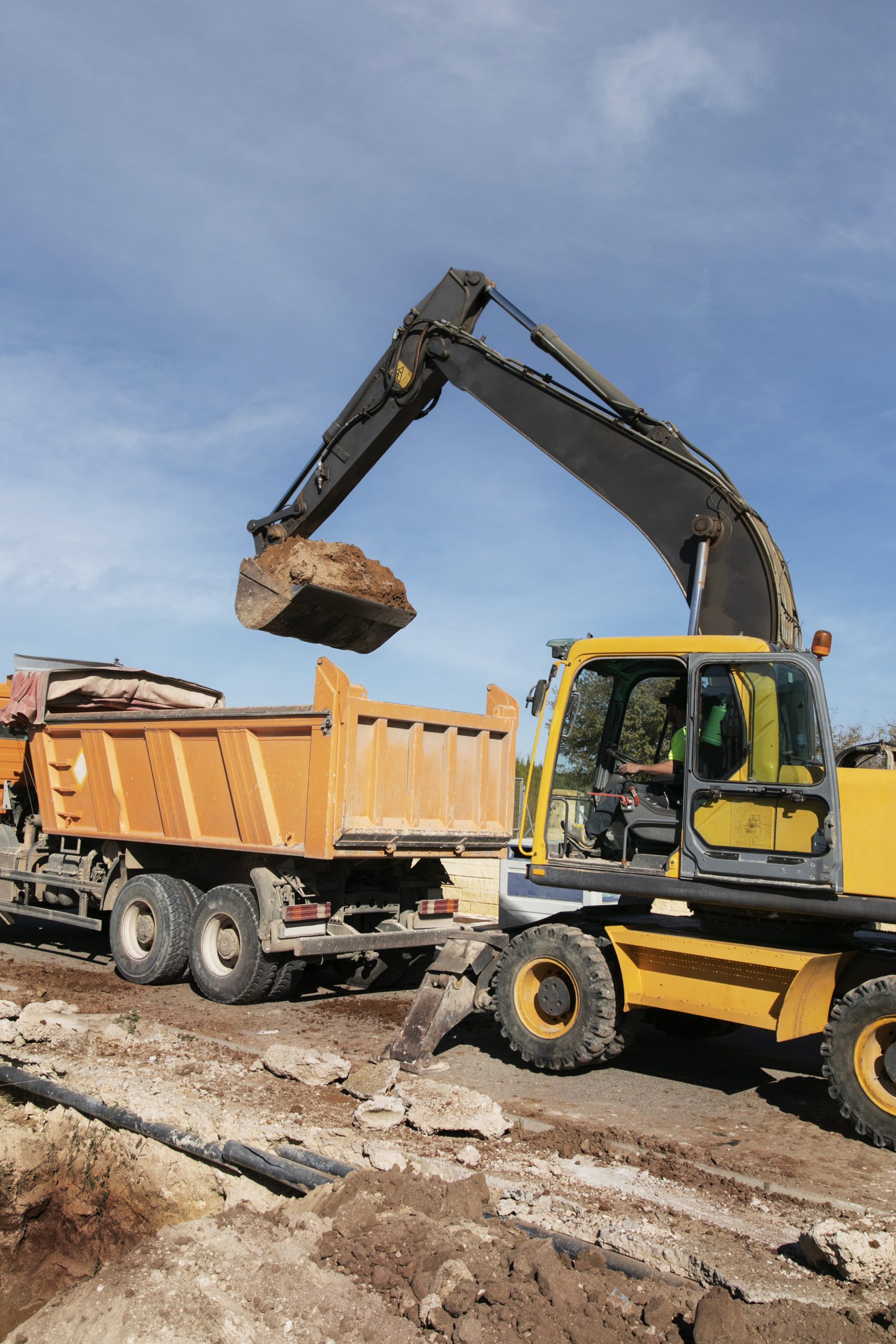 Inicio excavator digging ground day light